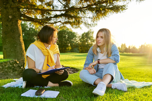 Female,Teacher,Psychologist,Social,Worker,Talking,To,Teenage,Student,On