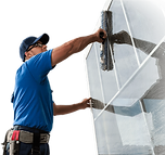 man cleaning window