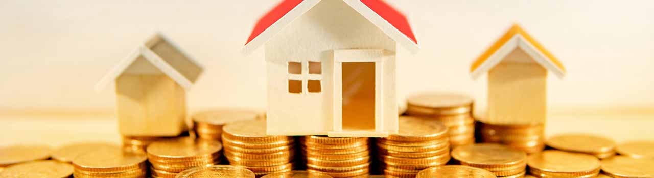 3 houses sitting on coins